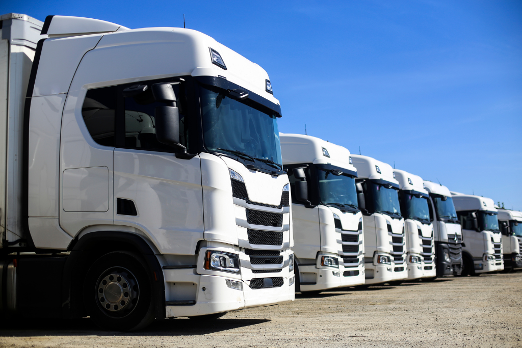 a row of lorries or trucks on a yard
