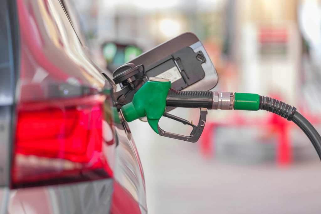 petrol pump filling up a car at a petrol station